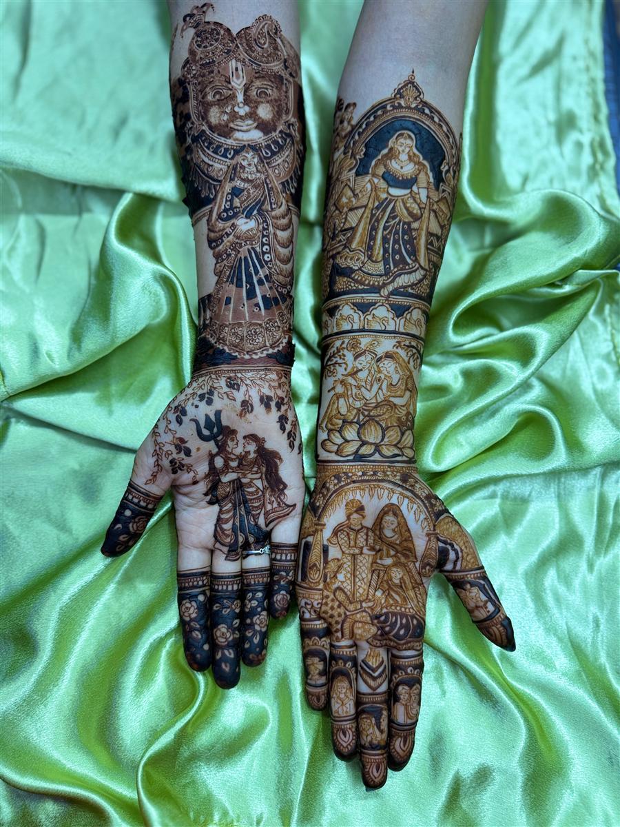 Bridal arms with Krishna face and family scenes