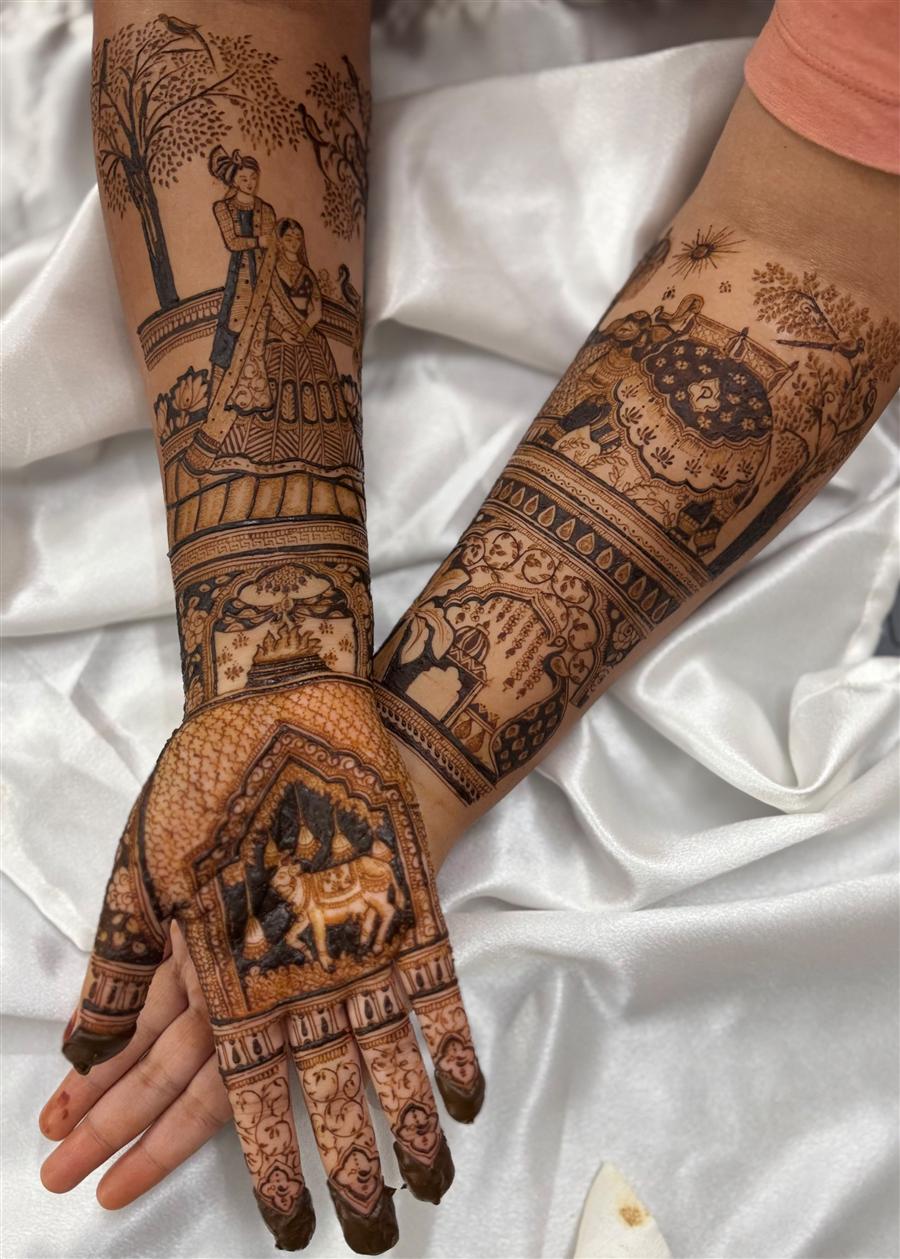 Bridal arms with couple under tree and fire ceremony