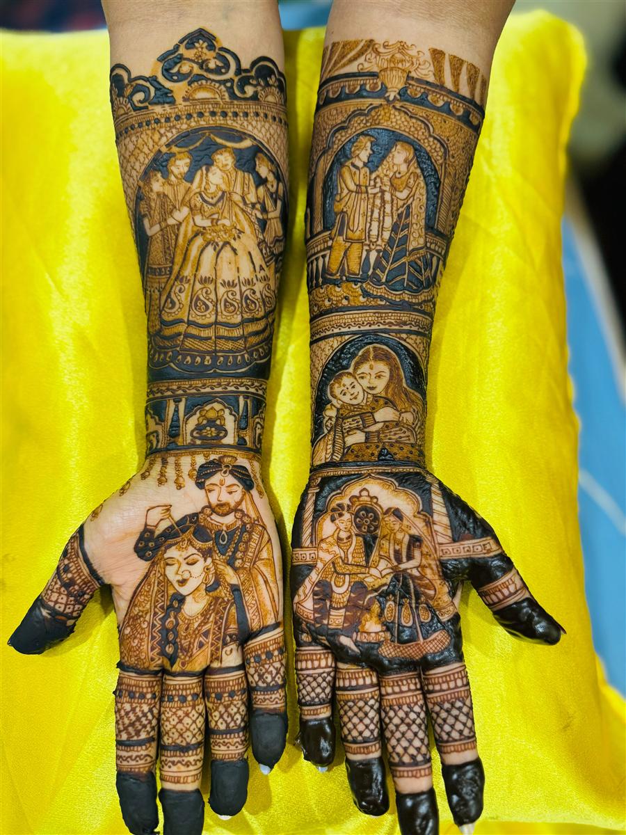 Bridal hands with wedding scenes and mother-child motif