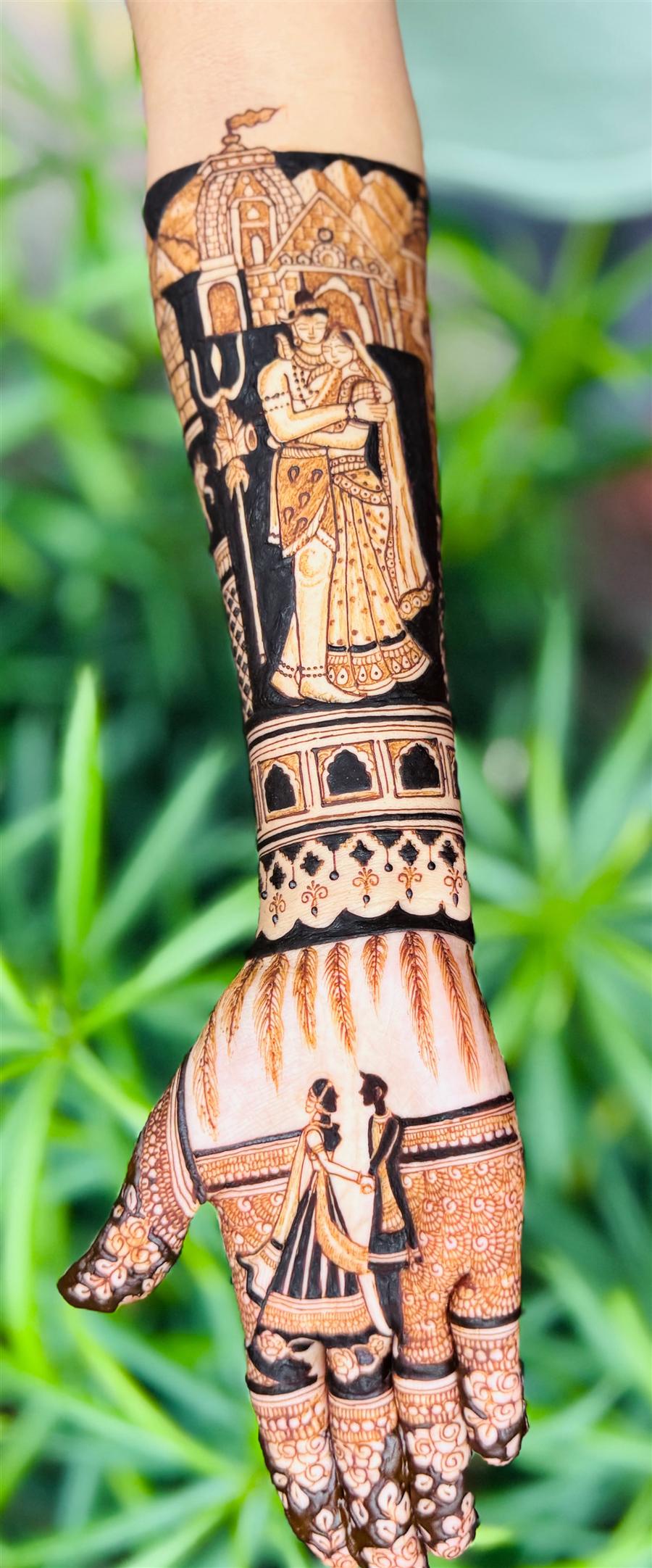 Shiv and Parvati temple scene on a bridal arm