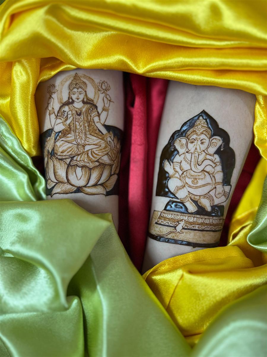 Lakshmi and Ganesh on two arms