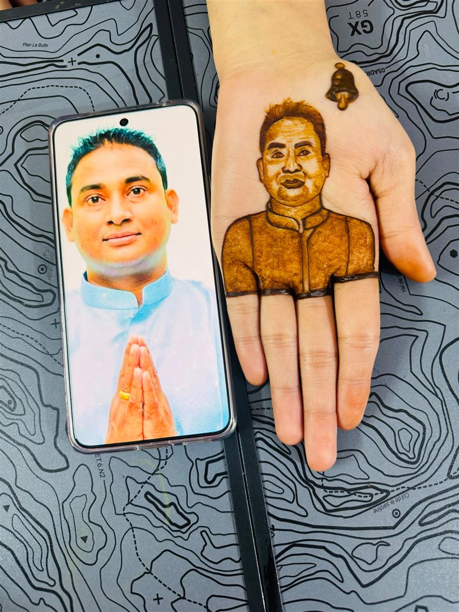 Realistic man's portrait recreated in henna on a palm