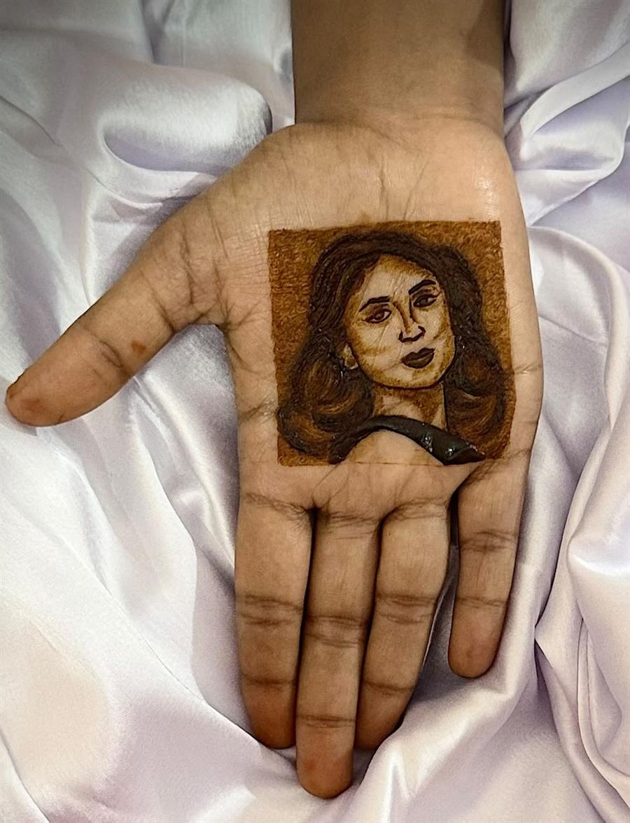 Bollywood style portrait in henna on a palm