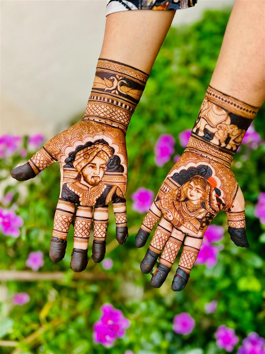 Groom and bride face portraits on two palms