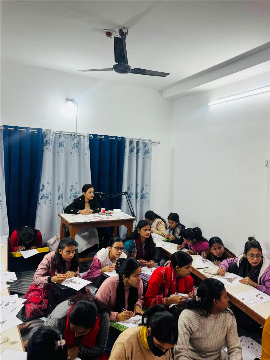 Students practising mehandi designs on paper